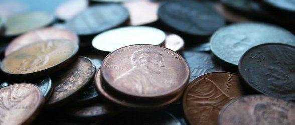A closeup photo of a pile of dirty pennies.