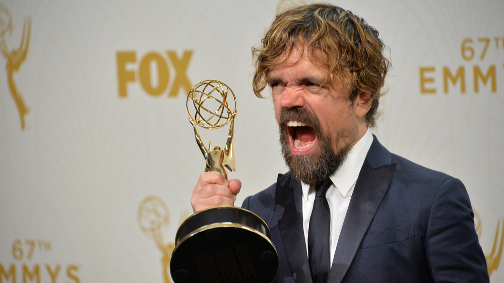 Photo of Peter Dinklage holding an Emmy