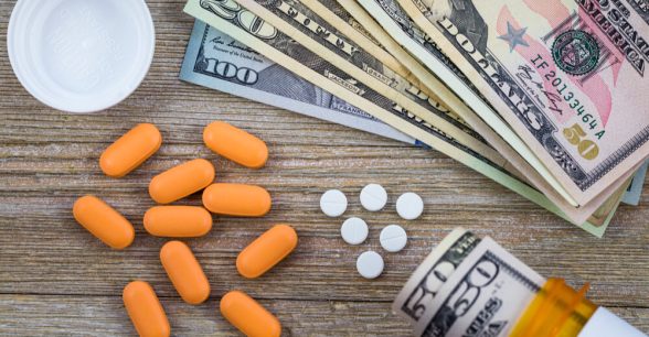 A photo of pills and American money, indicating "big pharma."