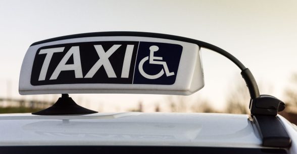 Taxi signage with wheelchair symbol