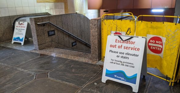 two broken escalators at Sound Transit station