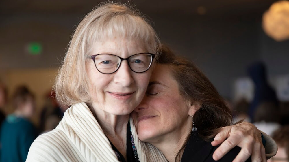 The author resting her head on her mother's shoulder