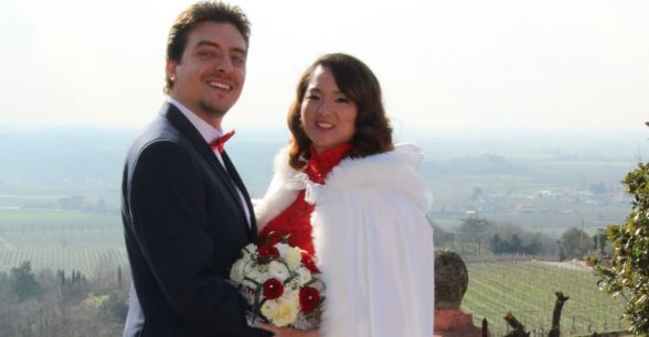 A wedding photo of the author and her husband.