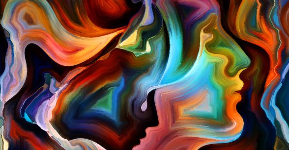 Arrangement of colorful paint and abstract shapes that look like human faces