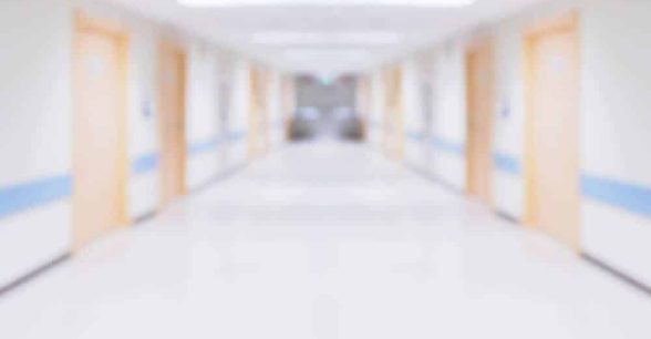 A blurred photo of an institution corridor.
