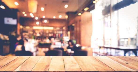 Blurred photo of people sitting in a cafe.