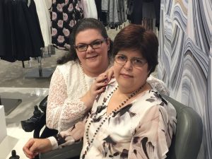 Emily and Ellen are smiling into the camera. 