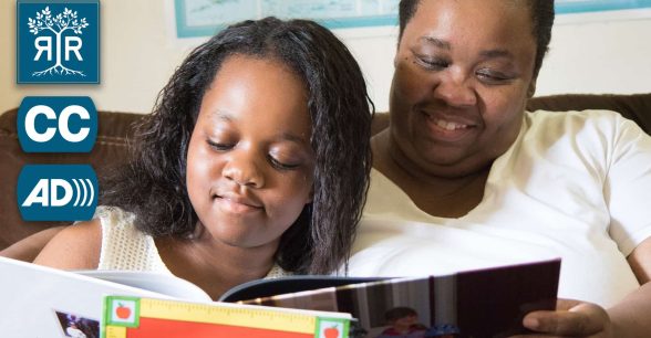 A mother and her daughter are happily reading a book.