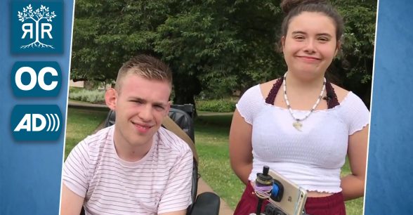 Two students smiling at the camera.