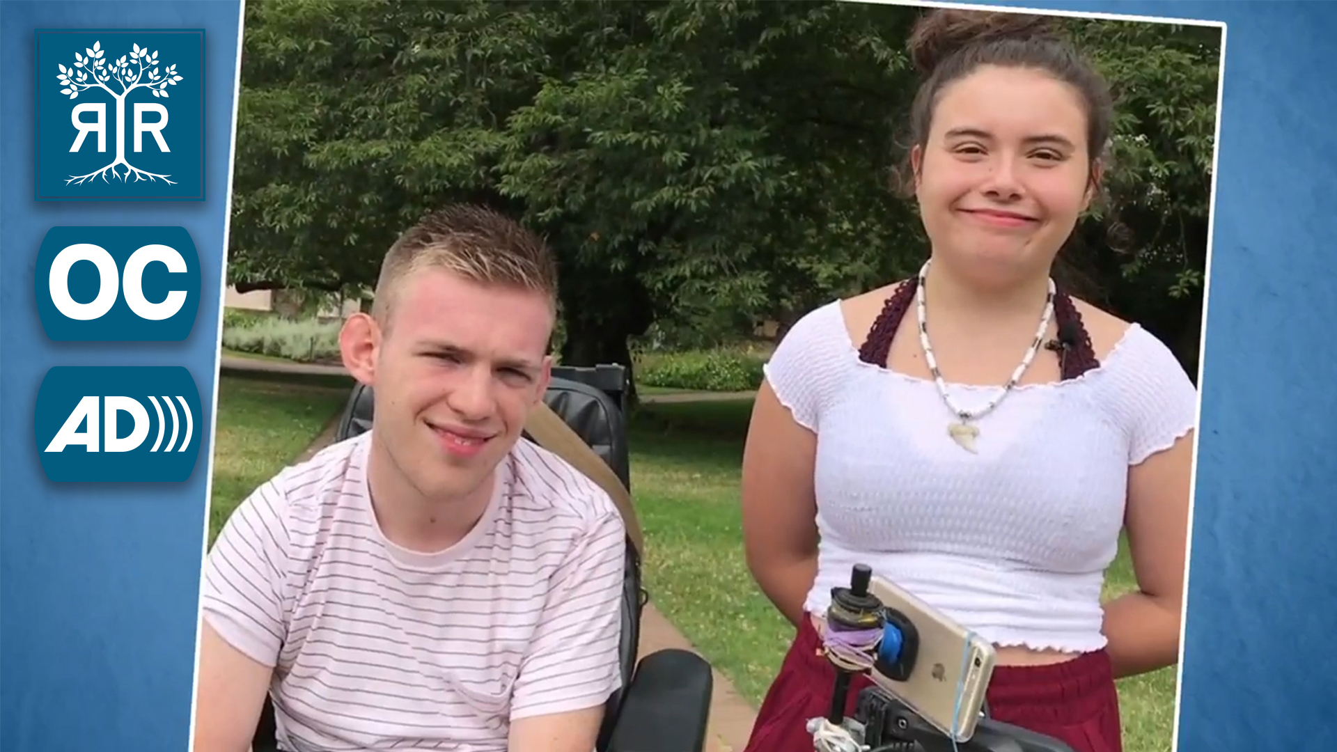 Two students smiling at the camera.