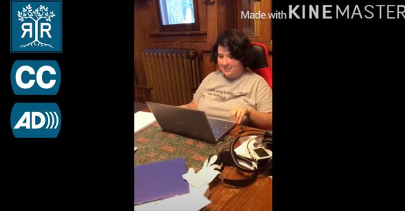 Risa sits in front of a laptop.