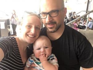 Family portrait of the Singer family, from left to right: wife, Steven, and baby.