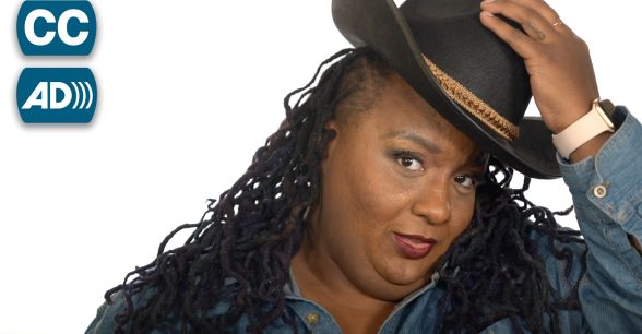 A young Black woman, Imani Barbarin, tips a cowboy hat.